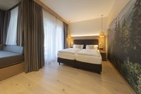 [Translate to english:] Waldnest Juniorsuite - Zimmeransicht