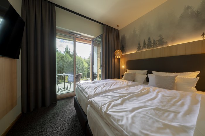 [Translate to english:] Weißtannensuite - Schlafzimmer